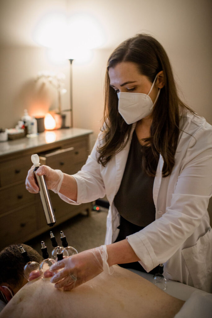 Dr. Whitney Applying Glass Cups