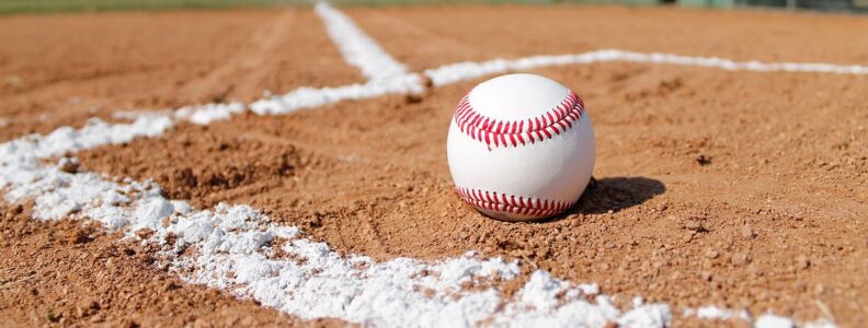 Free baseball on clay field close up image, public domain sport CC0 photo.